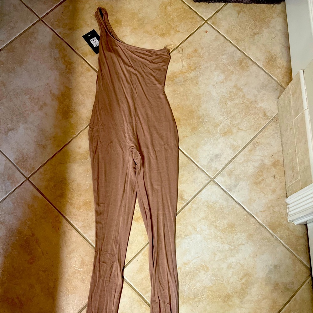 One piece half strap brand new xs